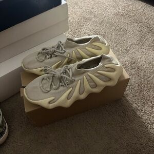 TWO PAIRS of Yeezy 450 white is size 9.5 black is size 9 $210